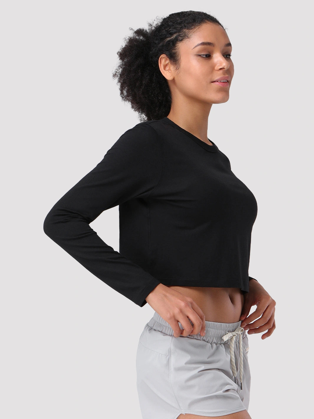 Top a manica lunga cropped e comodo da donna
