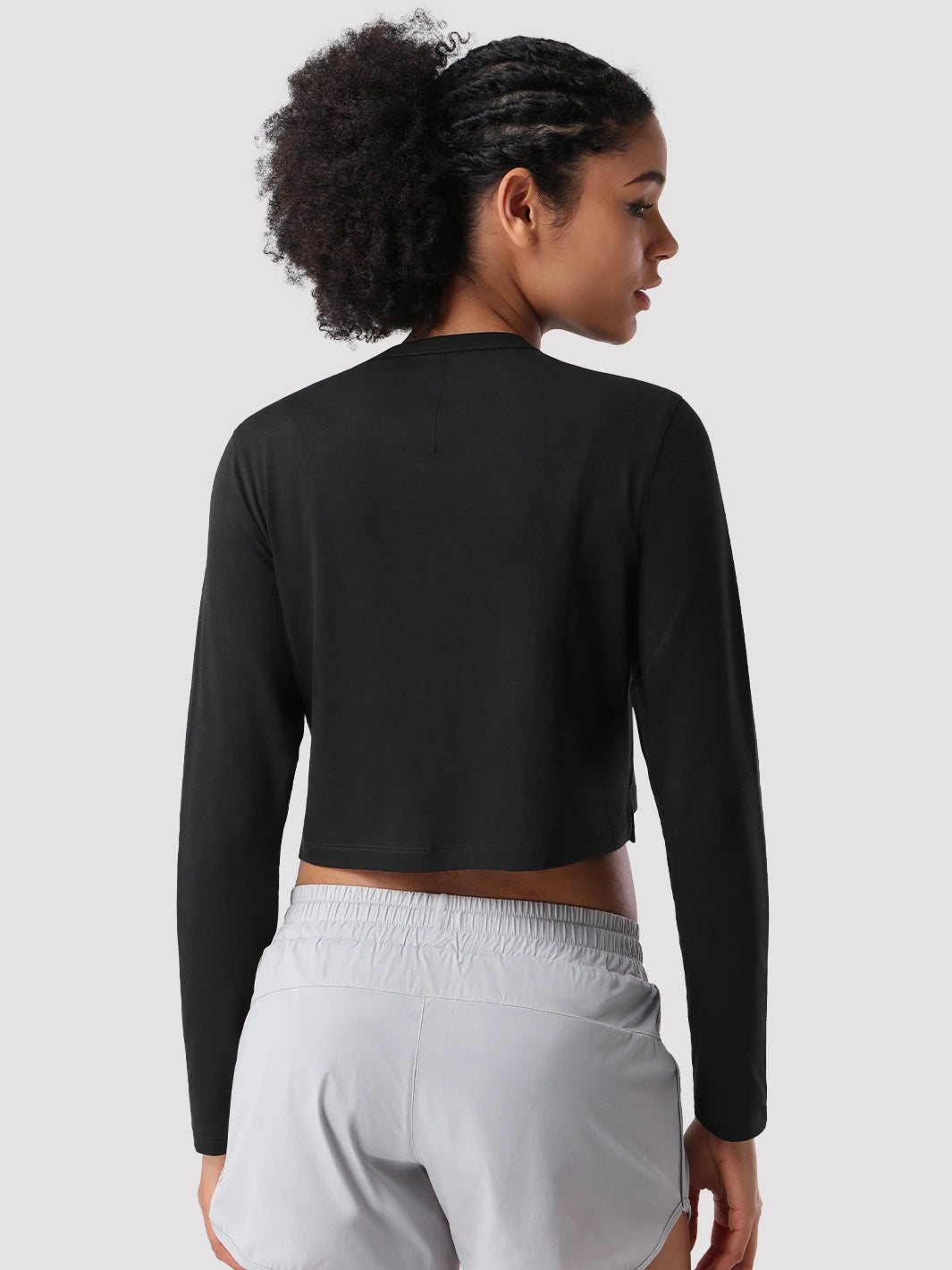 Top a manica lunga cropped e comodo da donna