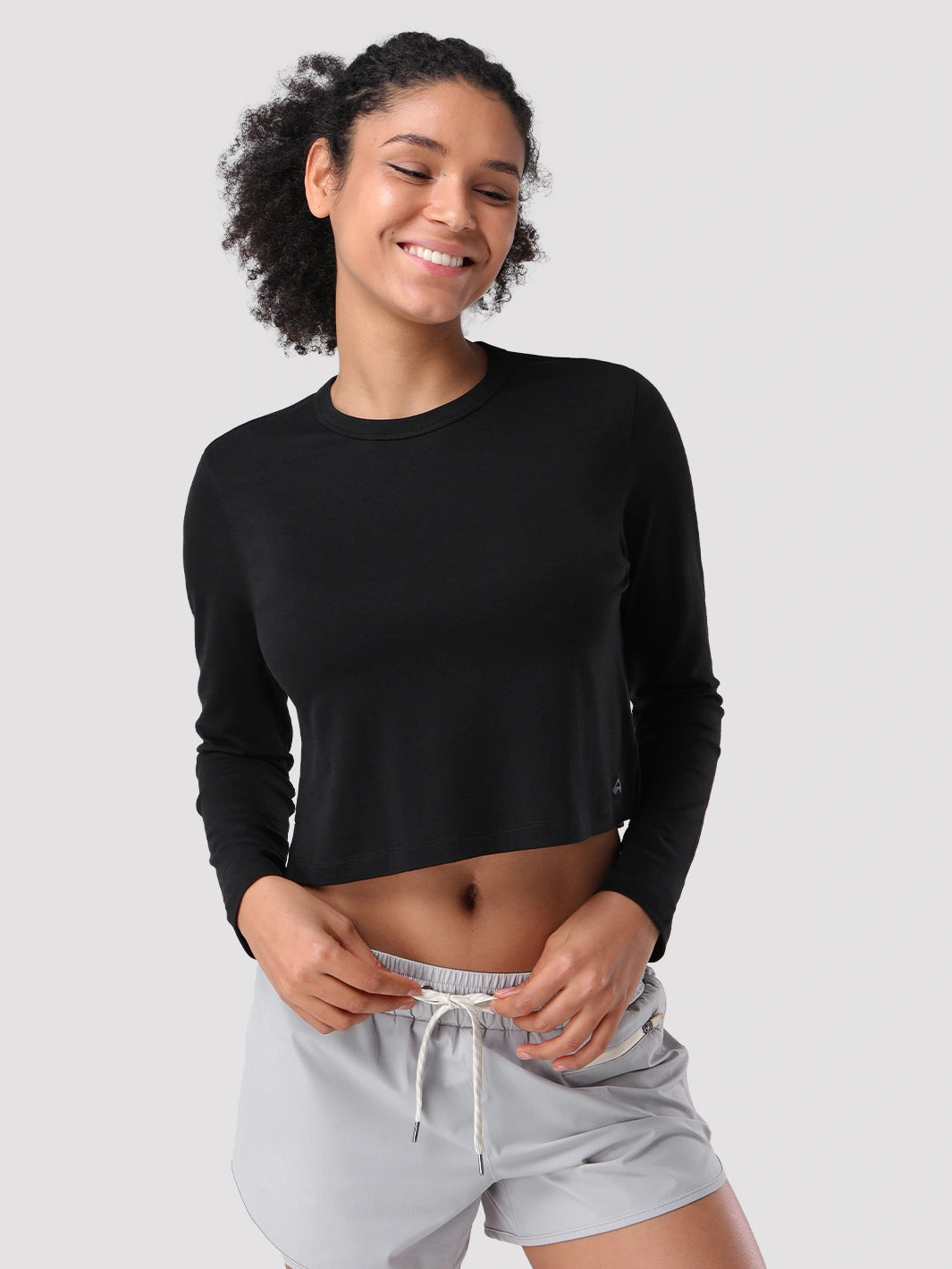 Top a manica lunga cropped e comodo da donna