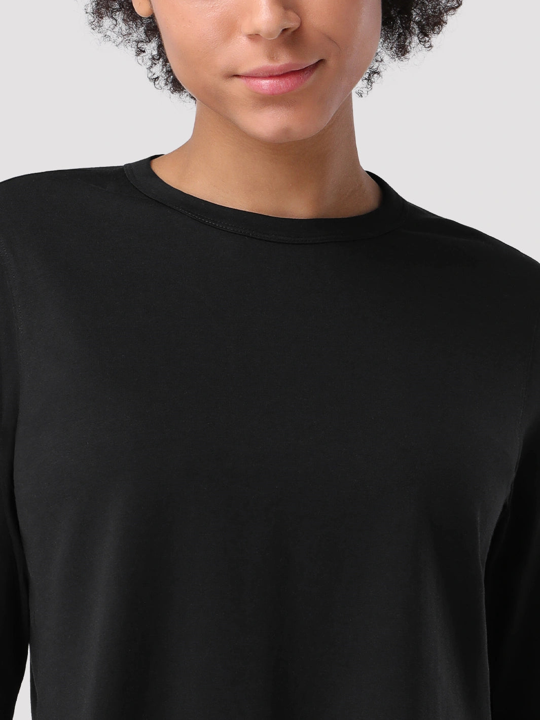 Top a manica lunga cropped e comodo da donna