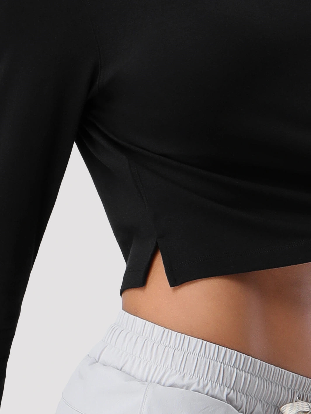 Top a manica lunga cropped e comodo da donna