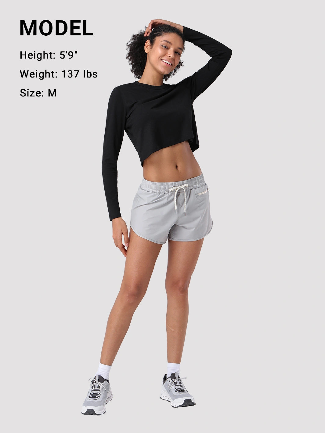 Top a manica lunga cropped e comodo da donna