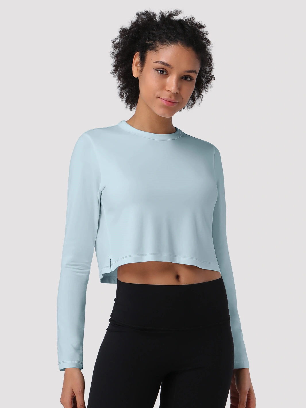 Top a manica lunga cropped e comodo da donna