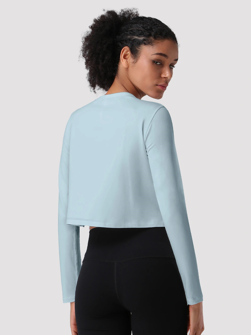 Top a manica lunga cropped e comodo da donna