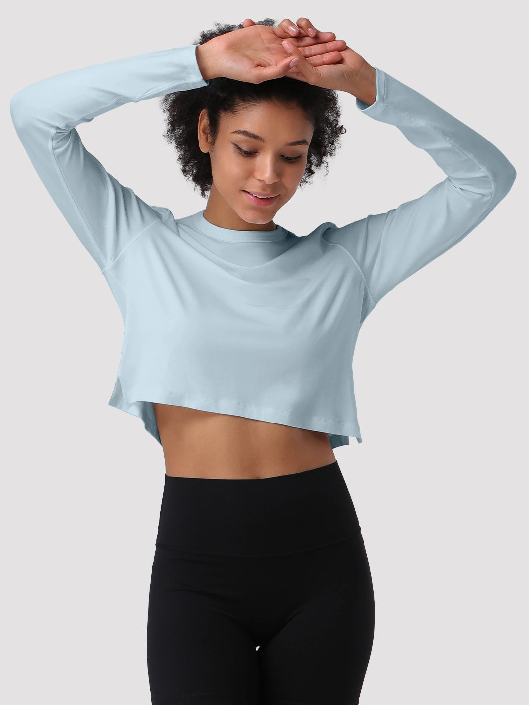Top a manica lunga cropped e comodo da donna
