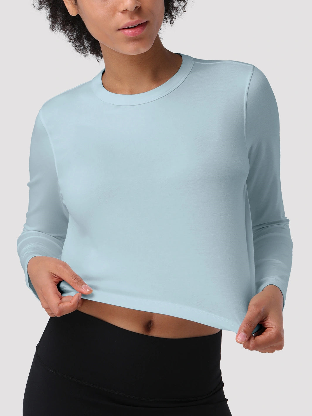 Top a manica lunga cropped e comodo da donna