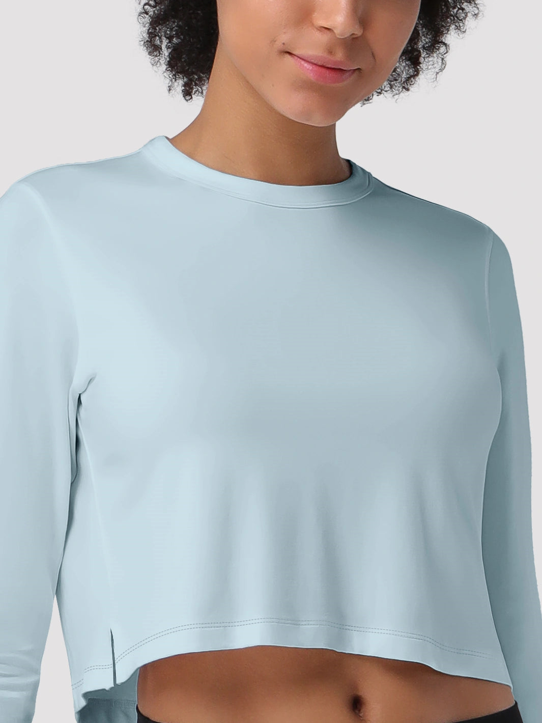Top a manica lunga cropped e comodo da donna