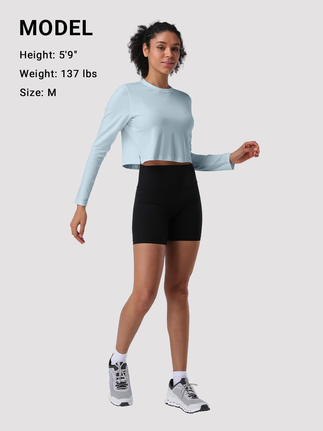Top a manica lunga cropped e comodo da donna