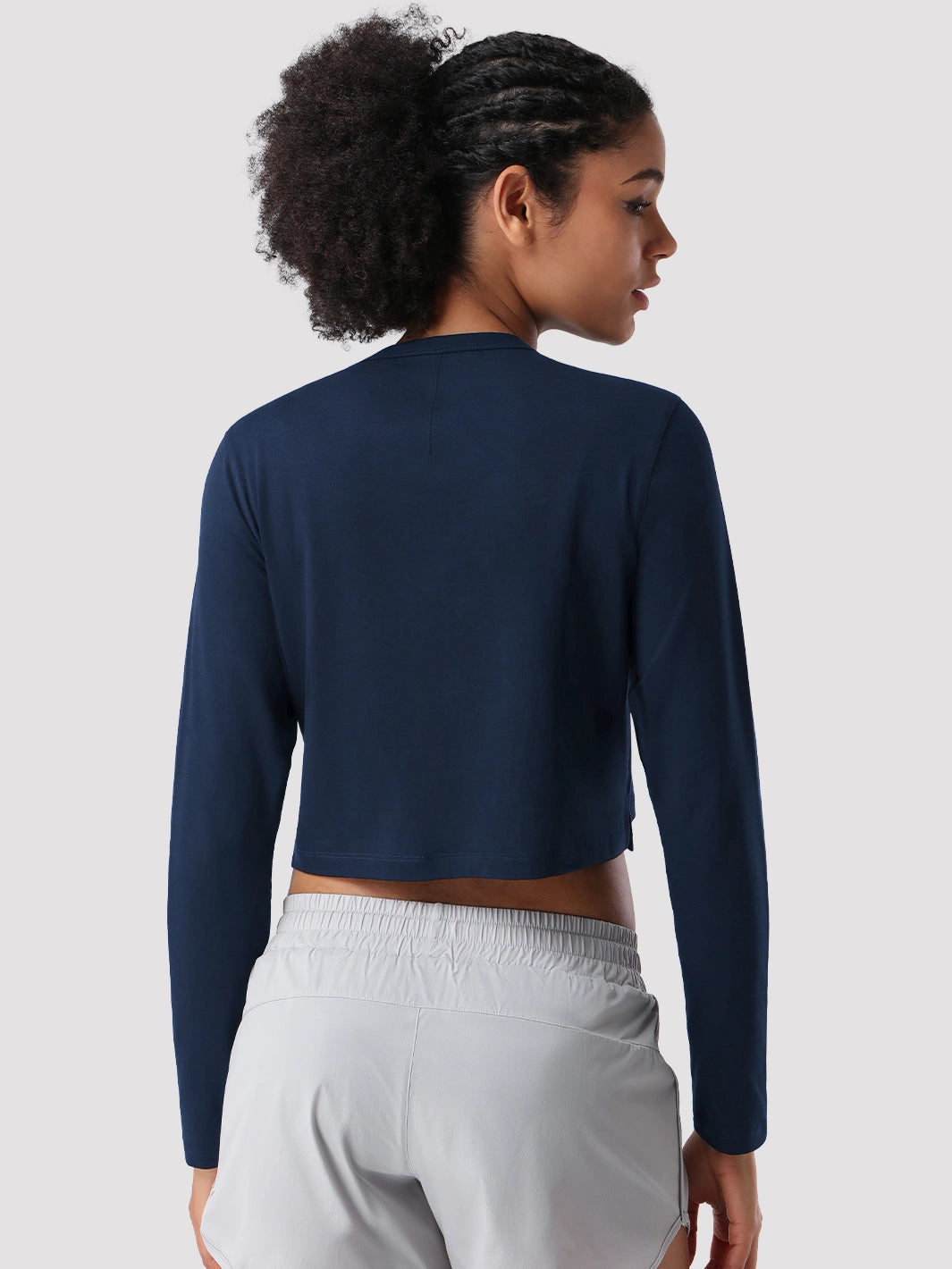 Top a manica lunga cropped e comodo da donna