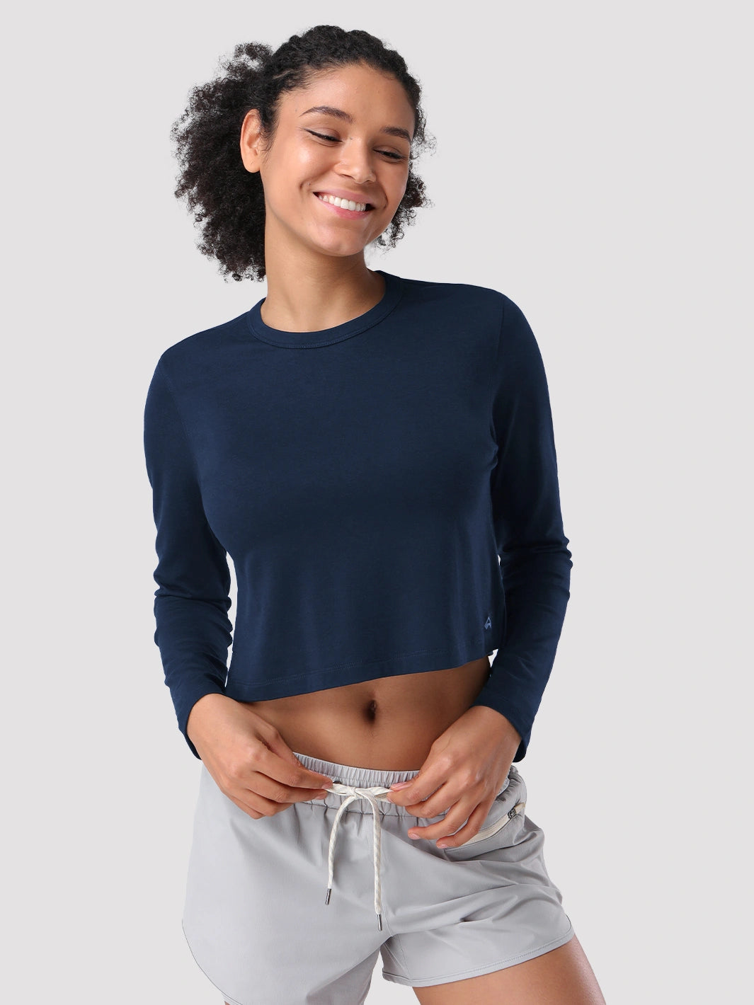 Top a manica lunga cropped e comodo da donna