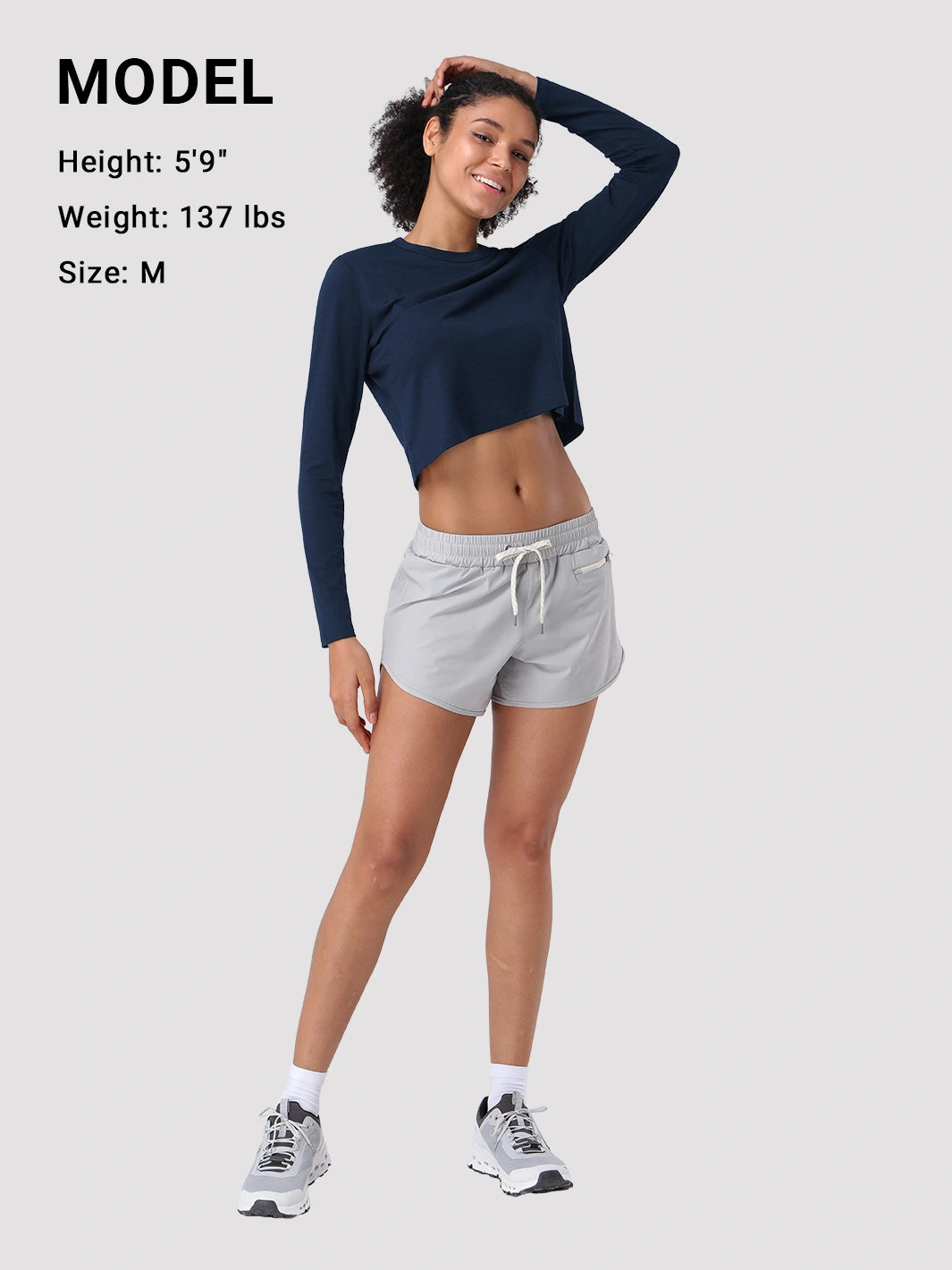 Top a manica lunga cropped e comodo da donna