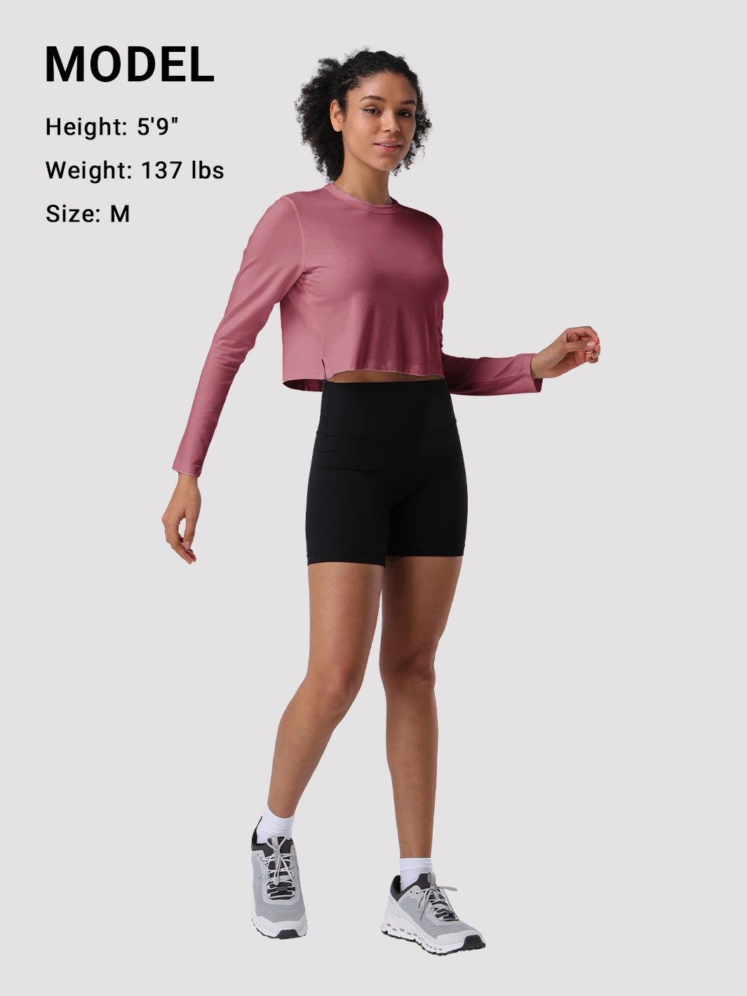 Top a manica lunga cropped e comodo da donna