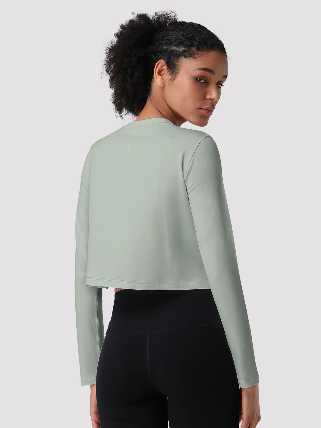 Top a manica lunga cropped e comodo da donna