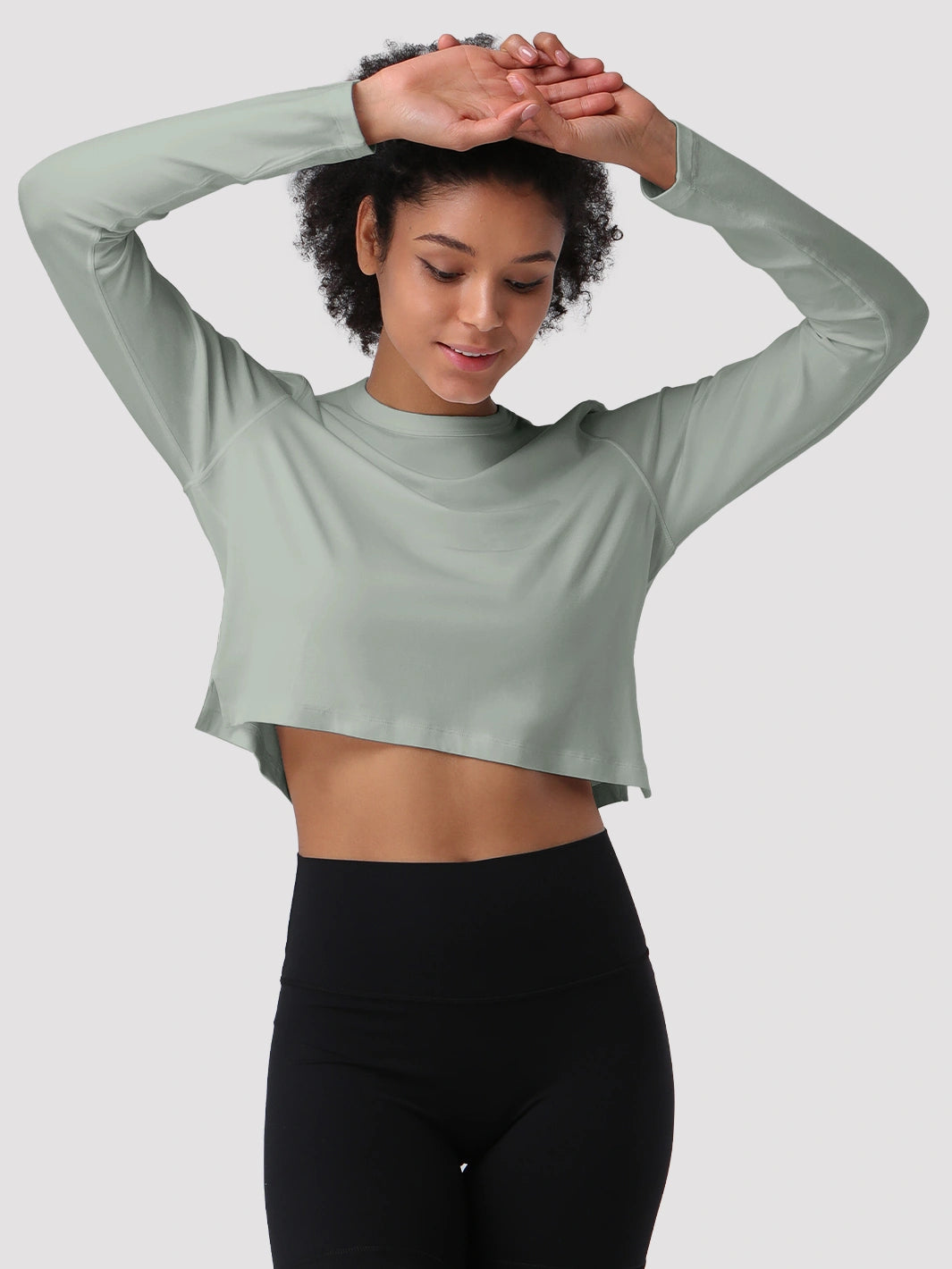 Top a manica lunga cropped e comodo da donna