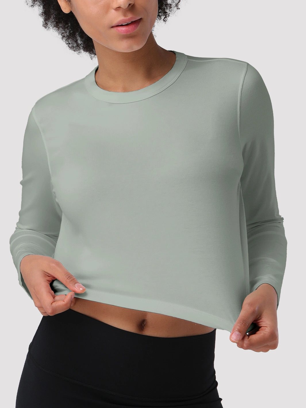 Top a manica lunga cropped e comodo da donna