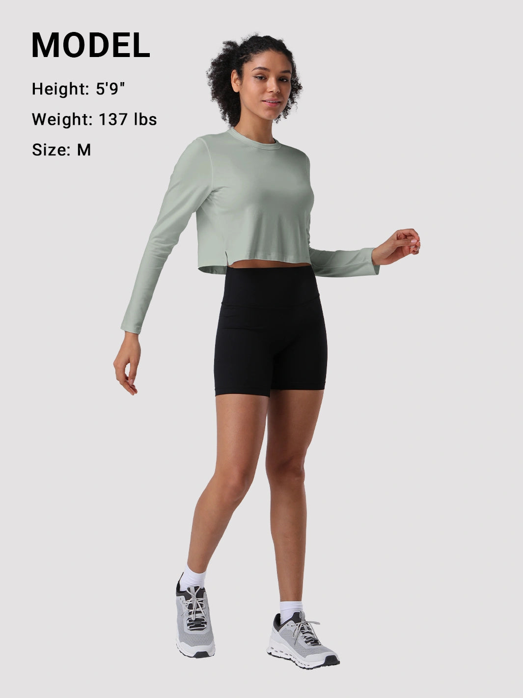 Top a manica lunga cropped e comodo da donna