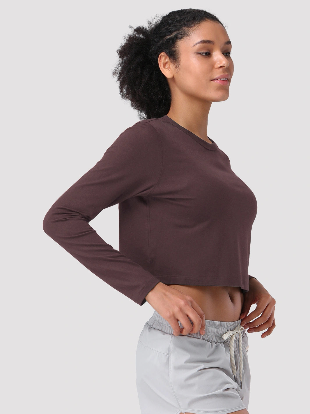 Top a manica lunga cropped e comodo da donna