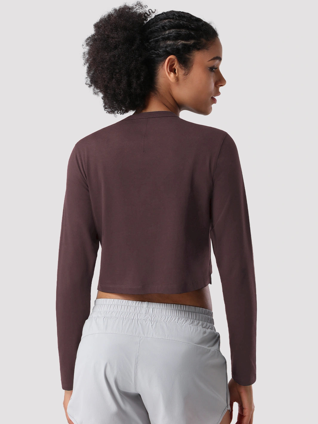 Top a manica lunga cropped e comodo da donna