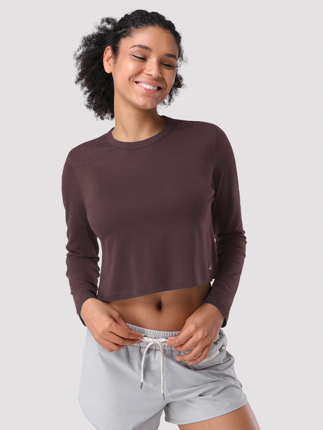 Top a manica lunga cropped e comodo da donna