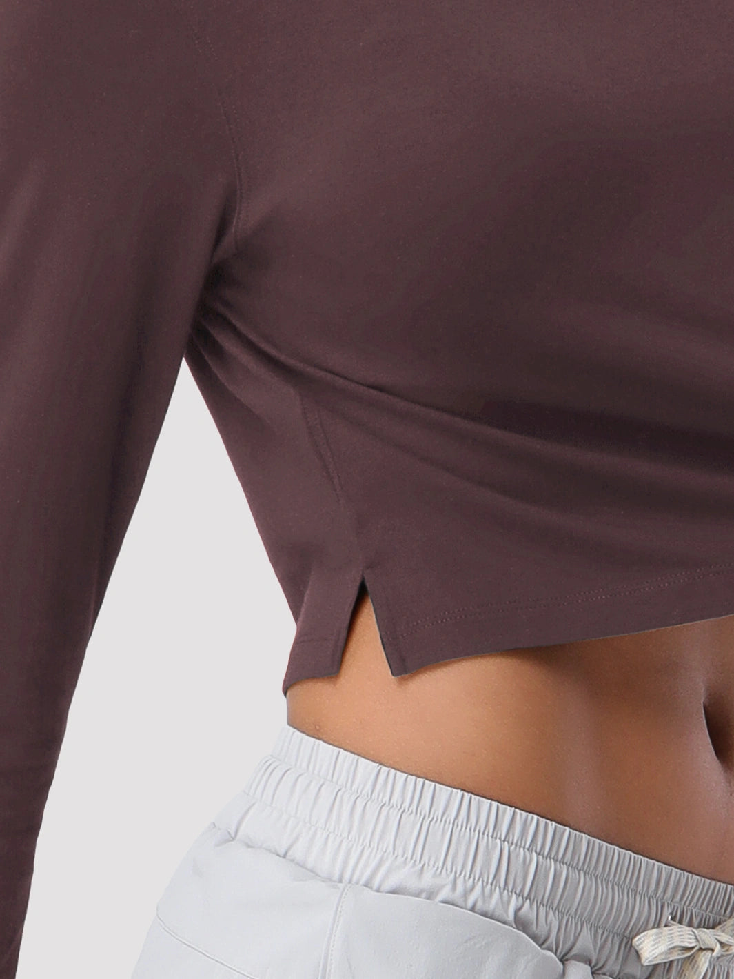 Top a manica lunga cropped e comodo da donna
