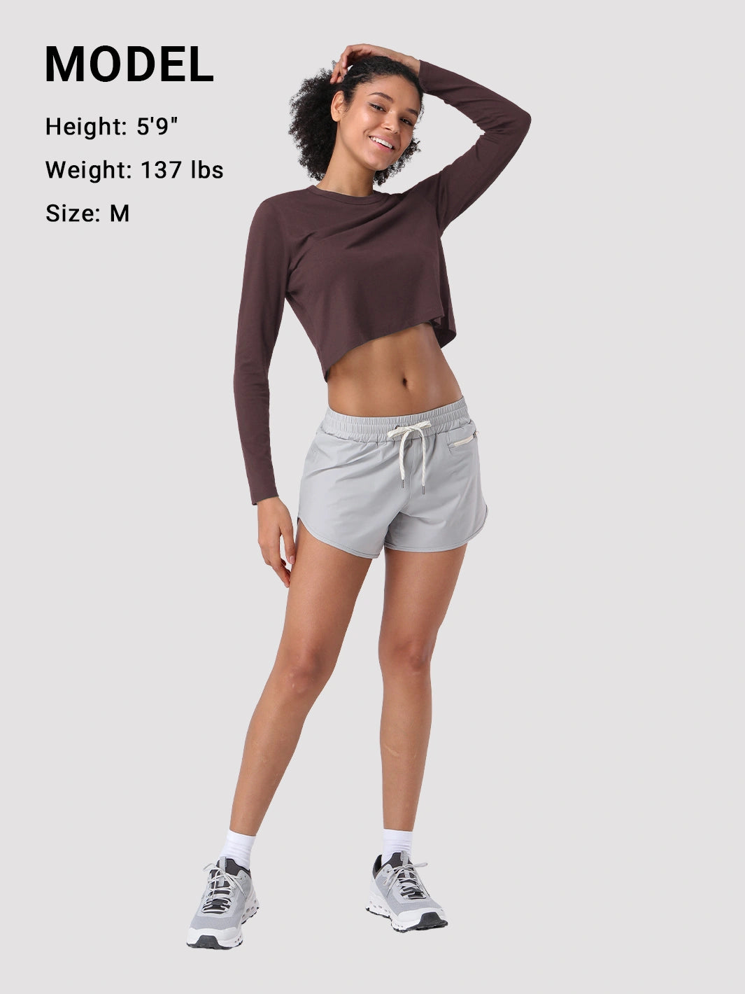 Top a manica lunga cropped e comodo da donna