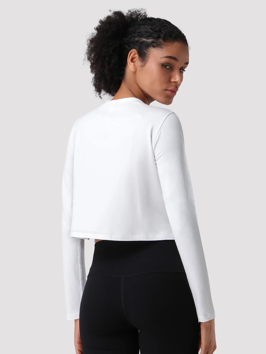 Top a manica lunga cropped e comodo da donna