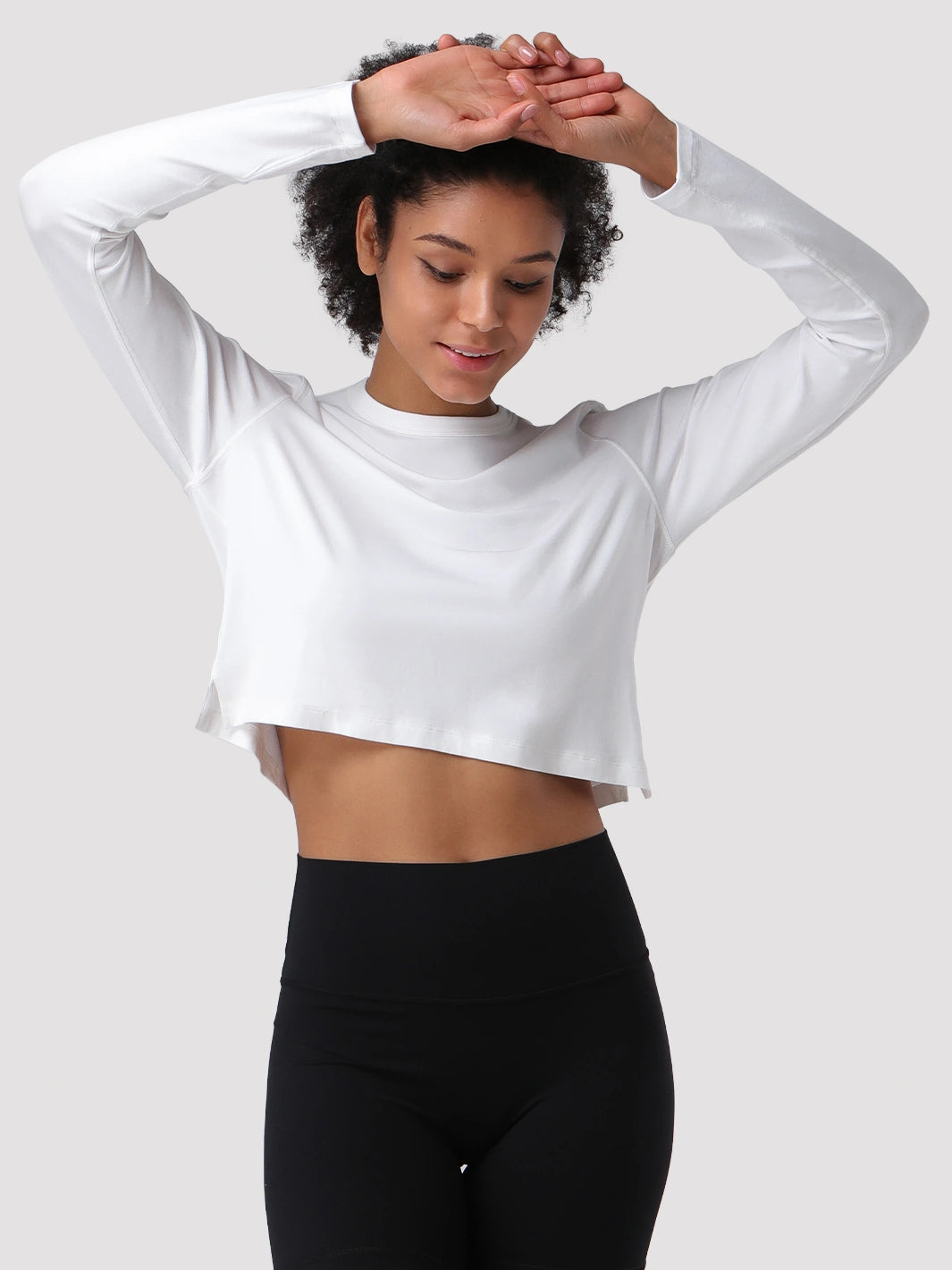 Top a manica lunga cropped e comodo da donna