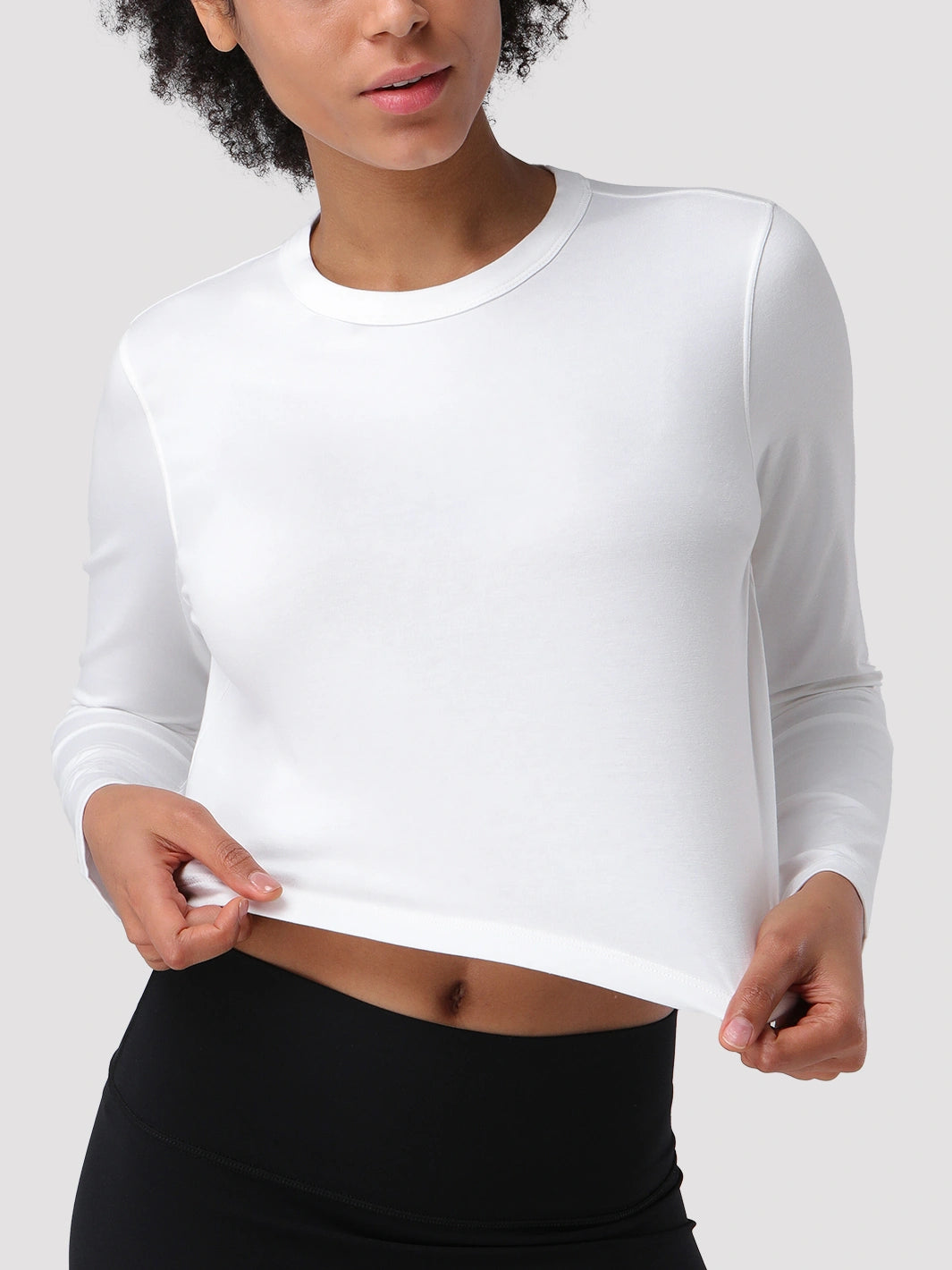 Top a manica lunga cropped e comodo da donna