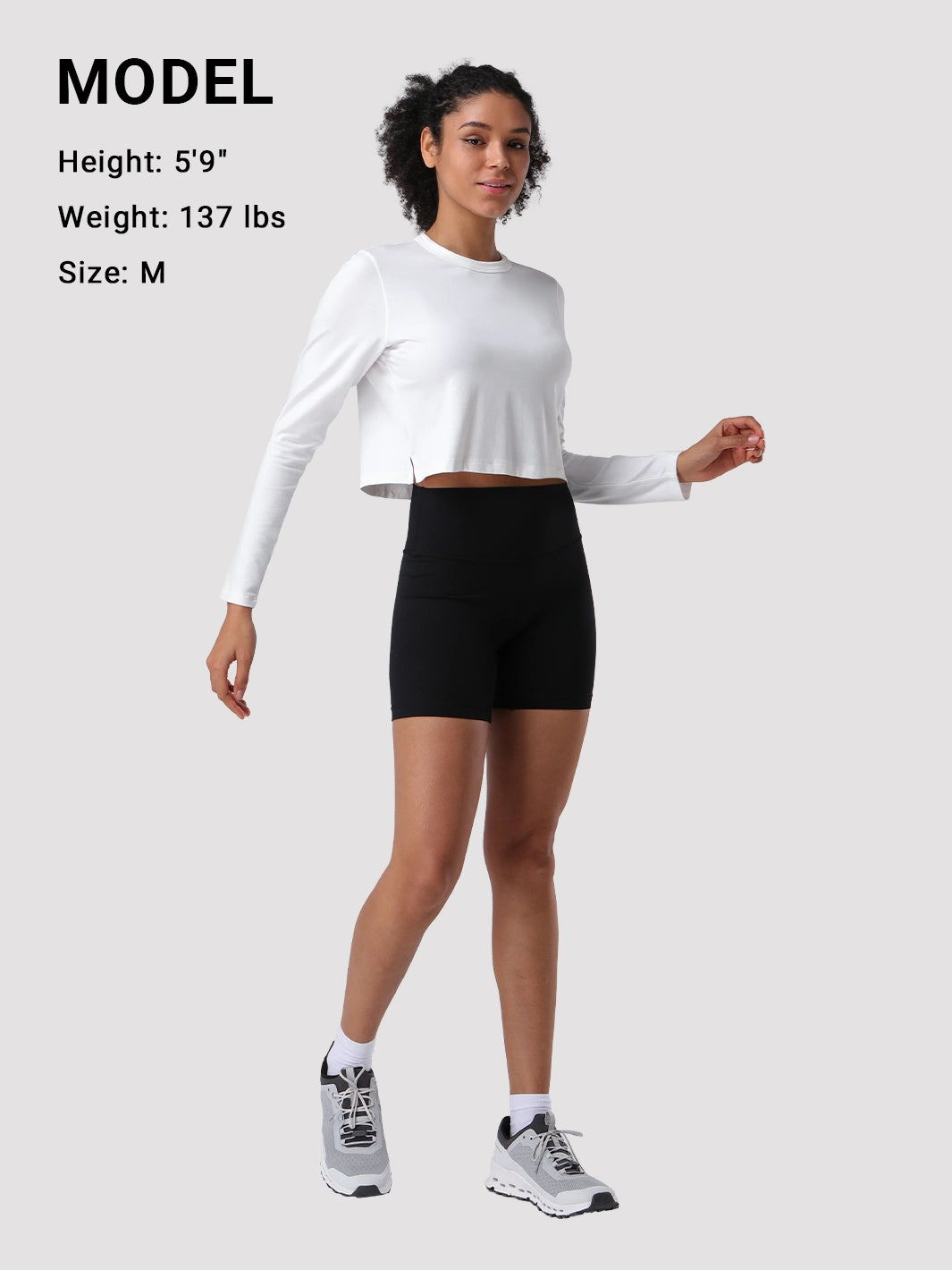 Top a manica lunga cropped e comodo da donna